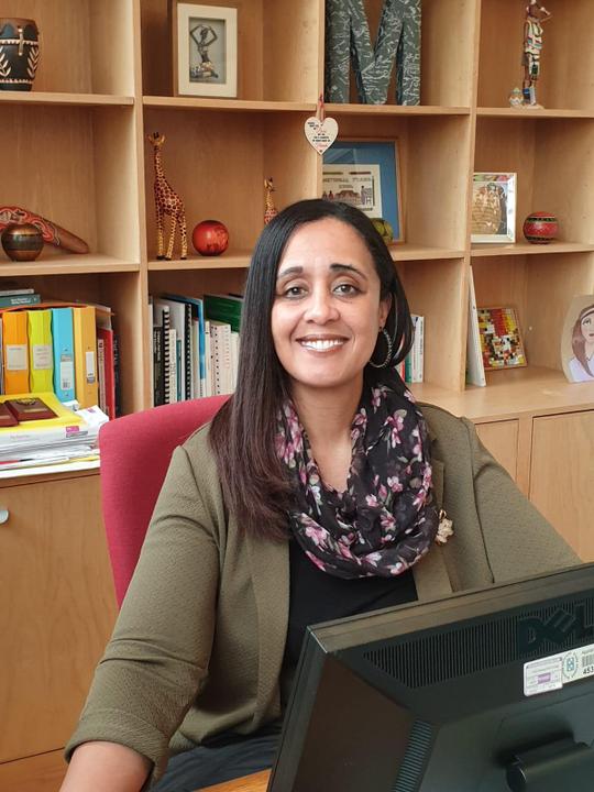 Photograph of Headteacher sitting at her desk