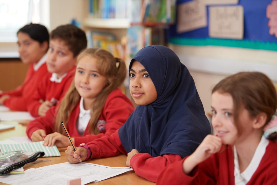 Pupils listening in class